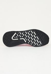 Black rubber outsole with a textured pattern, featuring pink accents and a white midsole. Designed for traction and durability.