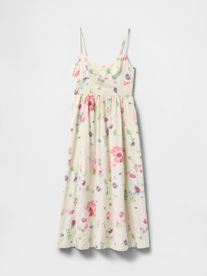Cream sleeveless midi dress with pink, red, purple, and green floral print and thin adjustable shoulder straps.