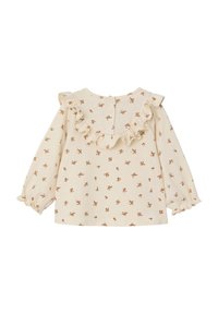 Long-sleeve cream blouse with small brown floral print, ruffled neckline, and elastic cuffs. Button closure at the back. Soft fabric texture.