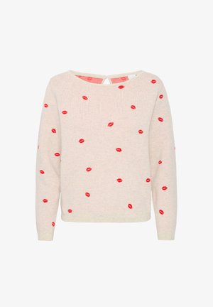 Knit sweater in light beige, featuring scattered red lip prints. Round neckline, long sleeves, and back keyhole detail. Soft texture.