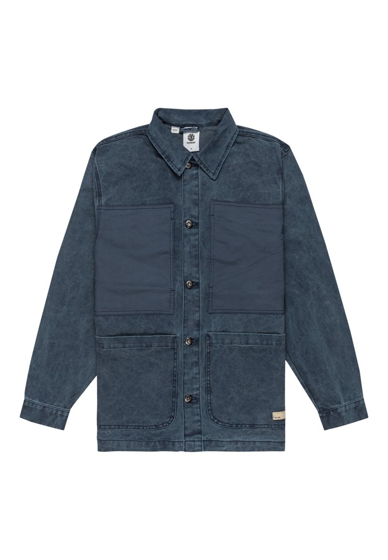 Denim jacket in dark blue, featuring a textured finish, two large chest pockets, and button closures. The design includes a collar and long sleeves.