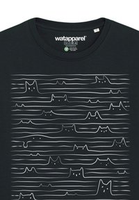 Black cotton t-shirt featuring a repeated white line drawing of stylized cats against a solid background, with varying heights and shapes.