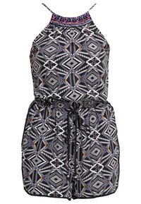 Mono con patrón en blanco y negro con escote halter, cintura elástica con lazo y adornos de cuentas de colores a lo largo del escote.