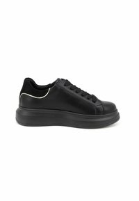 Black leather sneaker with thick rubber sole, black laces, and suede heel collar accented by thin white trim, side view.