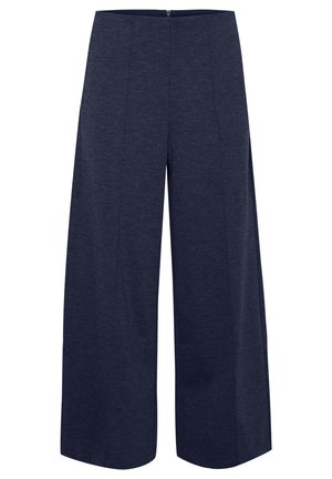 Pantalons larges en tissu bleu marine foncé, présentant une texture lisse et un motif chiné subtil, avec une fermeture éclair à l'arrière.