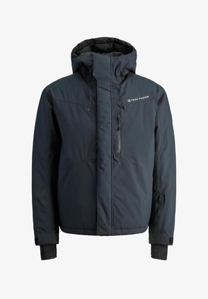 Veste isolante bleu marine avec un col haut, une capuche réglable, une poche zippée et des poignets élastiques. Elle présente un logo sur la poitrine.