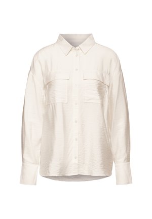 Kurzarm-Hemd in hellem Creme mit Knopfverschluss, zwei Brusttaschen und entspannter Passform. Hergestellt aus einem strukturierten, leichten Stoff.