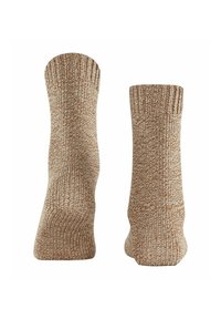 Skarpetki dziane w miękkim odcieniu beżowym z fakturowanym wzorem. Długość do kostki z ściągaczami, zapewniające przytulne i ciepłe uczucie.
