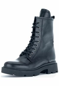 Black leather lace-up boot with metal eyelets, round toe, and chunky rubber sole. Features textured upper and stitched accents.