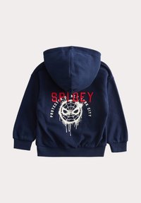 Námořnický modrý mikina s kapucí se bílým emblémem pavouka, červeným textem "SPIDEY" a nápisem "CHRAŇTE NEW YORK CITY" pod grafickým designem.