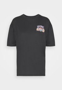 Black cotton t-shirt with short sleeves, round neckline, and a colorful floral graphic on the left chest. Smooth texture, relaxed fit.