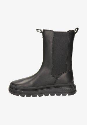 Bottines noires en cuir lisse avec des inserts élastiques sur les côtés, des languettes pour les enfiler, et une semelle épaisse en caoutchouc pour une meilleure adhérence.