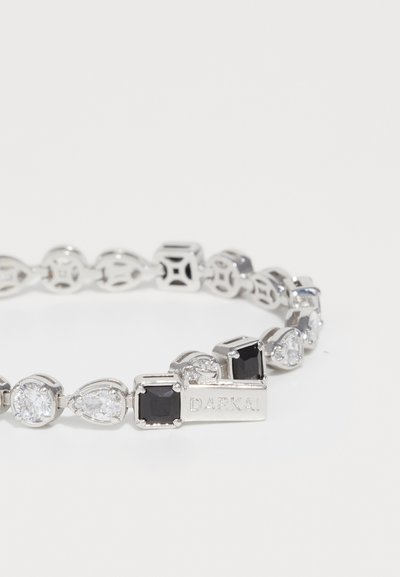 Silver bracelet with alternating black square and clear teardrop and round gemstones, featuring a clasp engraved with "DARKAI".