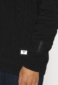 Carlo Colucci Trui - black