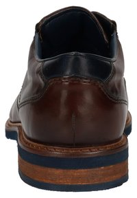 Braunes Leder-Schuh mit abgerundetem Absatz und marineblauen Akzenten. Verfügt über eine Holz-Zwischensohle und eine strukturierte Gummisohle für guten Grip. Insgesamt glatte Oberfläche.