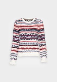 Pull en tricot avec un motif flocon de neige et géométrique en rouge, marine et blanc. Comprend un col arrondi et des poignets côtelés.