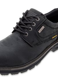 Black leather lace-up shoe with textured upper, silver-tone eyelets, and rubber sole. Features a small metallic logo and yellow accent.
