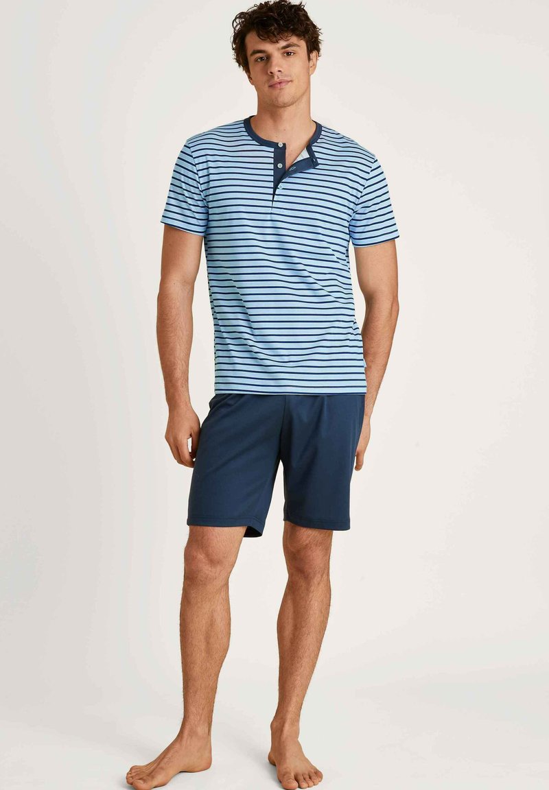 Blue and white striped short-sleeve shirt with a navy collar, paired with navy shorts. Cotton material, relaxed fit, casual design.