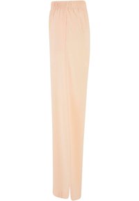 Pantalon beige clair à jambes droites avec taille élastique et une petite fente latérale à l'ourlet.