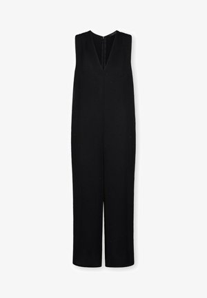 Combinaison noire sans manches avec col en V et jambes larges, présentant de subtils embellissements à pois sur tout le tissu.