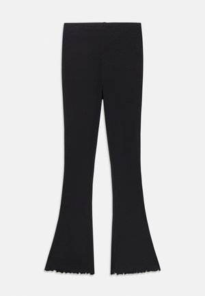 Svarte flared leggings laget av elastisk stoff, med en glatt midje og en frynset kant i bunnen.