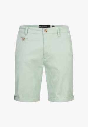 Vaaleanvihreät puuvillashortsit, joissa on sileä pinta. Varusteena nappikiinnitys, sivutasku ja käännetyt lahkeet. Rentoa tyyliä.