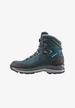 Hiking boots in dark teal suede with gray rubber toe cap, metal eyelets, and curved sole. Features stitching details and reinforced heel.
