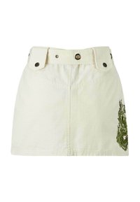 Mini gonna bianca con vita strutturata e bottoni a pressione neri. Presenta un design di drago ricamato verde sul lato. Tessuto testurizzato.