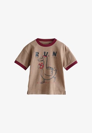 Beige child’s T-shirt with maroon collar and sleeve edges, featuring cartoon duck running with red soccer ball and "RUN Good Club" text.