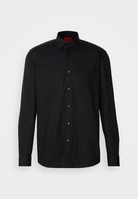 Chemise noire à manches longues avec col classique et boutons visibles, présentée à plat sans mannequin sur un fond uni.