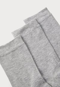 Gray cotton socks with a smooth texture, featuring a ribbed cuff and classic mid-calf length. Three pairs arranged side by side.