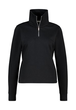 Felpa nera con collo alto, mezza cerniera, maniche lunghe, polsini a coste e un tessuto dalla superficie liscia. Design semplice e minimalista.