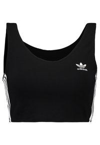 Černý zkrácený top bez rukávů z bavlny s kulatým výstřihem, na levé straně má bílé logo adidas a bílé boční pruhy.