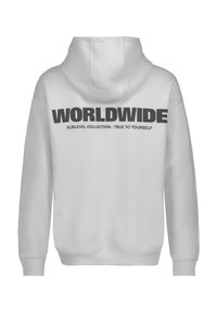 White hoodie featuring a large black "WORLDWIDE" print on the back, with smaller text reading "SUBLEVEL COLLECTION · TRUE TO YOURSELF."