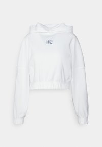 Biała krótka bluza z kapturem wykonana z miękkiej tkaniny, z logo na przodzie, długimi rękawami i regulowanym kapturem na sznurek. Wykończenia mankietów i dołu bluzy z prążkowanego materiału.