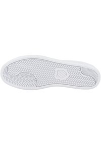 White sneaker sole with a textured rubber surface; features herringbone and zigzag patterns for grip; logo imprinted near heel area.