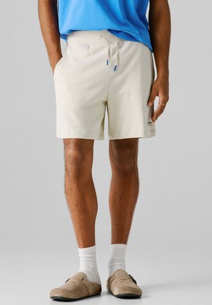 ESSENTIAL - Spodnji deli trenirk - sand