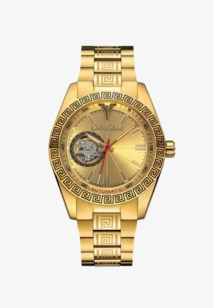 Goldene Automatik-Uhr mit einem gemusterten Armband und einem runden Gehäuse. Verfügt über ein Skelett-Zifferblatt, rote Akzente und griechische Schlüssel-Motive.