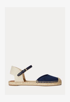 Sandale espadrille tissée bleu marine et beige avec un bout fermé, une bride à la cheville et une semelle en jute tressé.