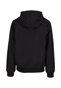 Black hooded jacket with elastic cuffs and a hem, featuring a smooth fabric texture and a simple, minimal design.