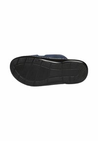 Sole di scarpa in gomma nera con un motivo testurizzato e scanalature per una migliore aderenza, e una leggera curvatura verso le dita per un design ergonomico.