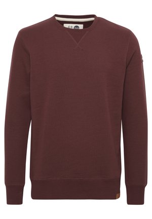 Bordeaux kleurige sweatshirt met lange mouwen, ronde halslijn, ribgebreide manchetten en zoom, gemaakt van zachte stof, met een klein merklabel aan de zijkant.