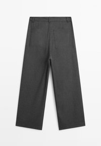 Gray pinstriped trousers featuring a wide-leg design and two back pockets. Made from a textured fabric with a smooth finish.