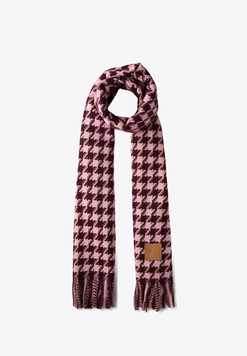 Różowo-burgundowy szalik w wzór houndstooth z frędzlami na końcach oraz skórzaną metką. Wykonany z miękkiego, fakturowanego materiału.