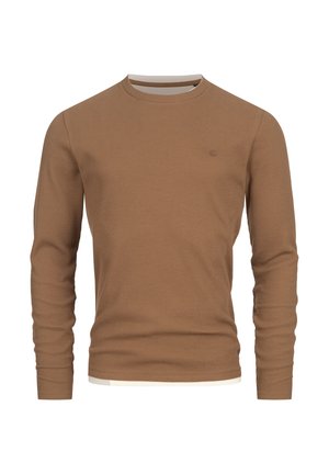 Brązowa prążkowana koszulka z długim rękawem, okrągłym dekoltem i białym wykończeniem przy kołnierzu oraz na dole. Na piersi znajduje się małe logo.