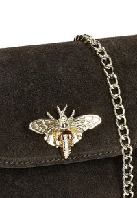 Black suede bag with a gold butterfly clasp, featuring intricate detailing and a metallic chain strap. Compact, rectangular design.