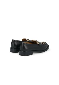 Black leather loafers with a flat sole, featuring a printed animal pattern on the top, slight gloss finish, and minimal stitching details.