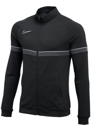Veste Nike noire à fermeture éclair complète avec manches longues, une bande blanche sur la poitrine et les manches, un logo Nike blanc sur le côté droit de la poitrine.