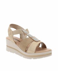 Sandali con tacco a cuneo beige, con una parte superiore morbida, design aperto e una fascia con dettagli di strass. Presentano una soletta imbottita e una suola leggera.