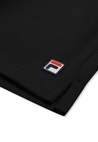 Manche en tissu noir avec un petit patch carré blanc présentant un logo stylisé "F" rouge et bleu marine près de l'ourlet.